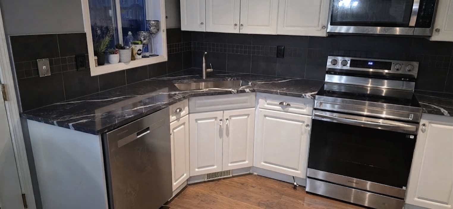 The same Calgary kitchen shown with dark marble countertops using Bedrock's AI visualizer